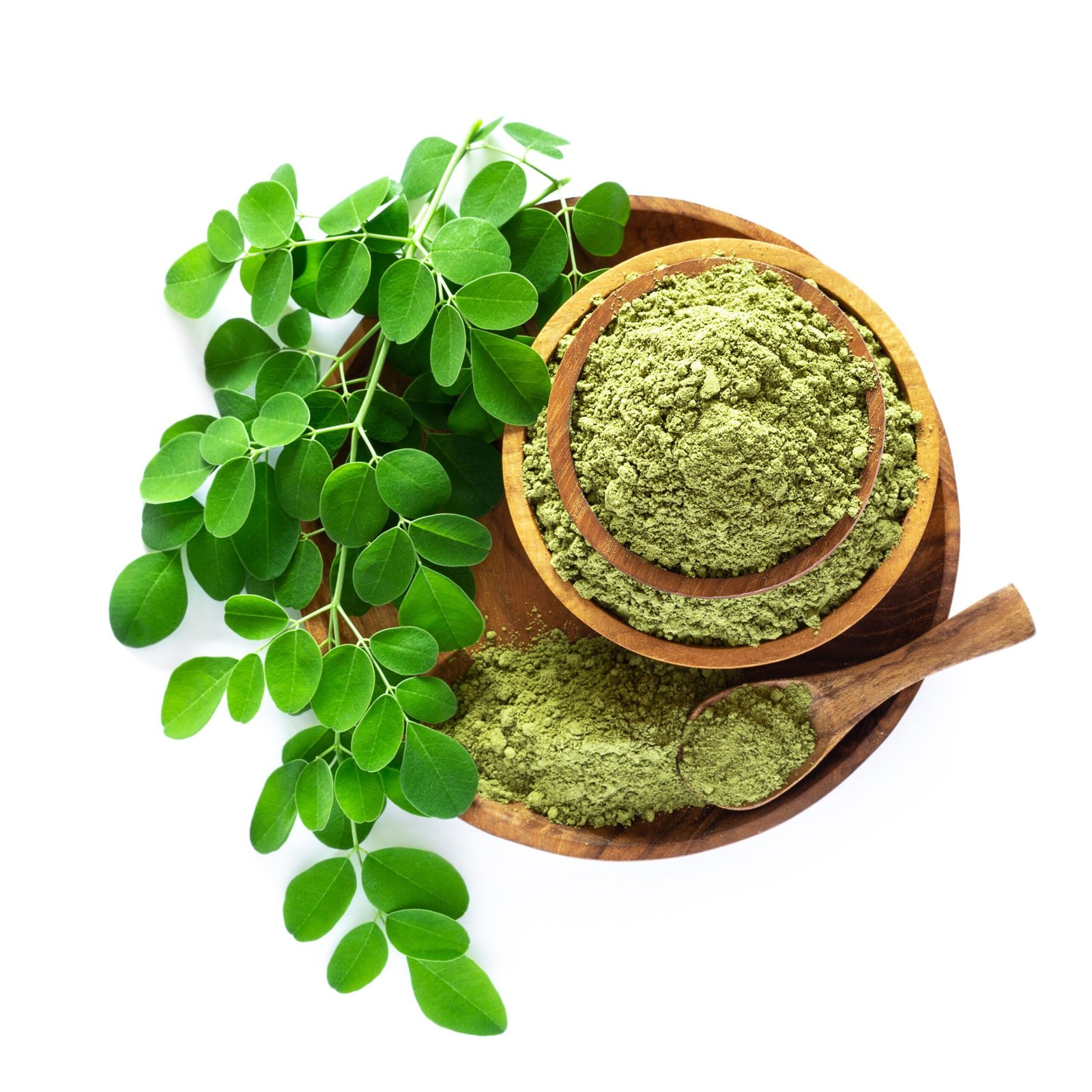 Moringa powder (Moringa Oleifera) in wooden bowl with original fresh Moringa leaves isolated on white background. Healthy product, superfood, vitamin. Top view.
